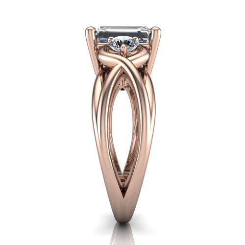 Ottilie emerald three stone engagement ring in 14K Rose Gold, side profile showing the braided ribbon shank with multiple bands twisting beneath the head