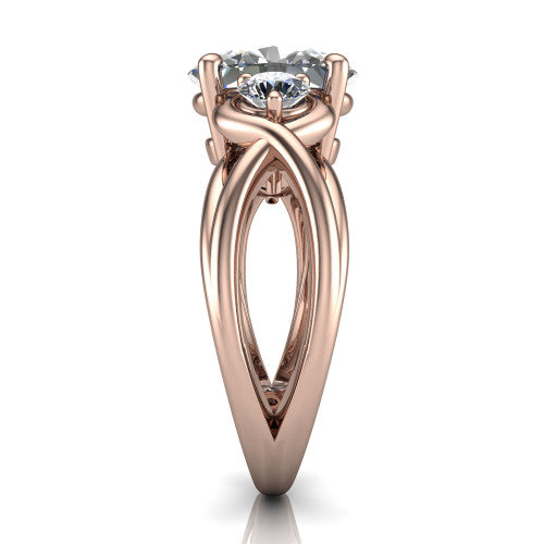 Ottilie oval three stone engagement ring in 18K Rose Gold, side profile showing the braided ribbon shank with multiple bands twisting beneath the head