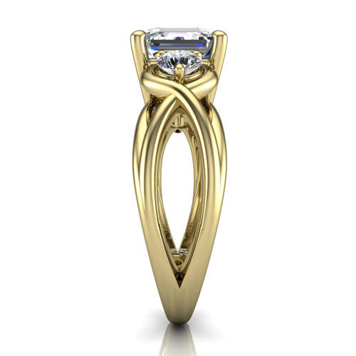 Ottilie square emerald three stone engagement ring in 18K Yellow Gold, side profile showing the braided ribbon shank with multiple bands twisting beneath the head