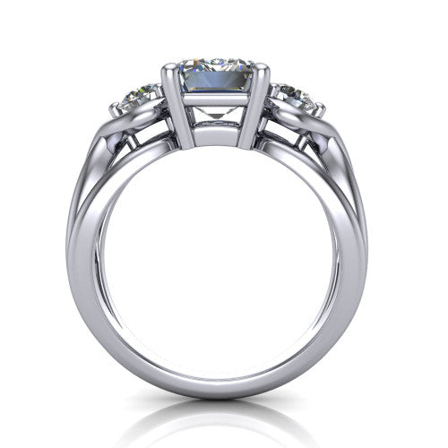 Ottilie emerald three stone engagement ring in 18K White Gold, through-finger front profile showing the three-stone head and sculpted scroll basket