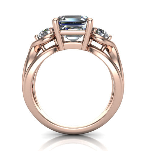 Ottilie square emerald three stone engagement ring in 14K Rose Gold, through-finger front profile showing the three-stone head and sculpted scroll basket