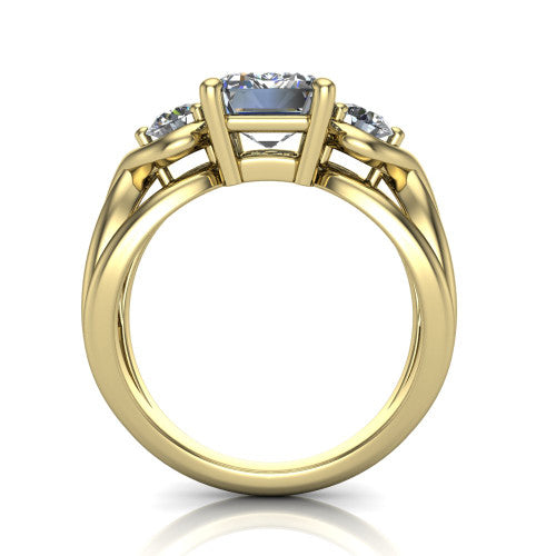 Ottilie emerald three stone engagement ring in 18K Yellow Gold, through-finger front profile showing the three-stone head and sculpted scroll basket