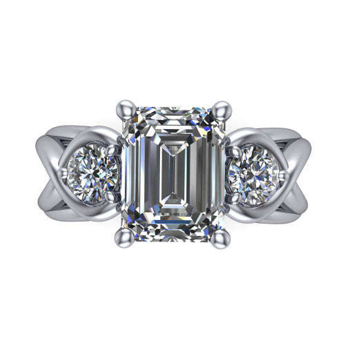 Ottilie emerald three stone engagement ring in 18K White Gold, top-down view showing the step-cut emerald center diamond with two matched round side diamonds
