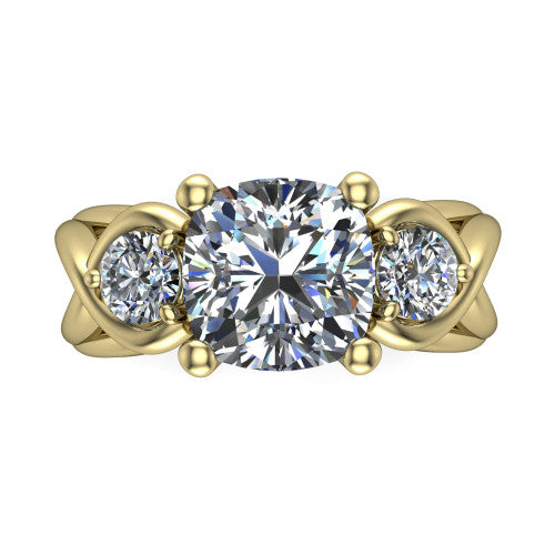 Ottilie cushion three stone engagement ring in 18K Yellow Gold, top-down view showing the brilliant cushion-cut center diamond with two matched round side diamonds
