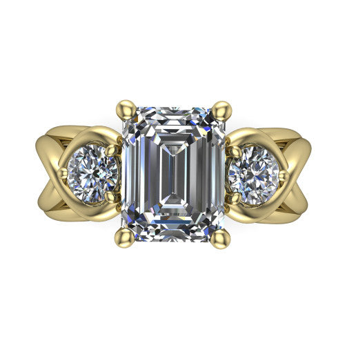 Ottilie emerald three stone engagement ring in 14K Yellow Gold, top-down view showing the step-cut emerald center diamond with two matched round side diamonds