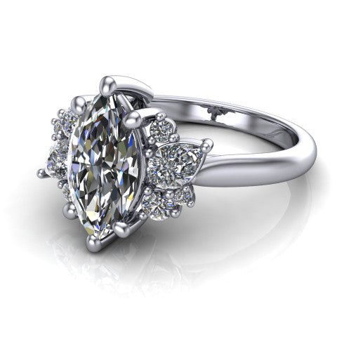 Evie marquise three stone engagement ring in 18K White Gold, three-quarter perspective showing the cathedral rise and accent clusters fanning out on both sides of the center