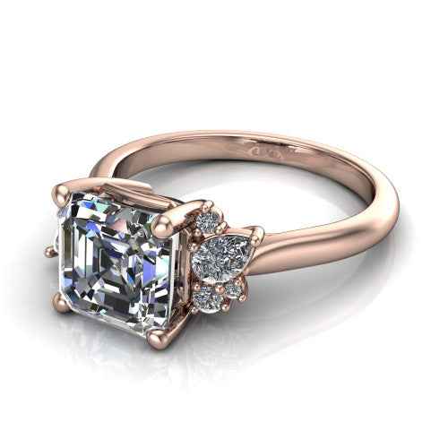 Genevieve square emerald vintage engagement ring in 14K Rose Gold, three-quarter perspective showing the step-cut square emerald center diamond flanked by clusters of small round accent diamonds on tapered cathedral shoulders