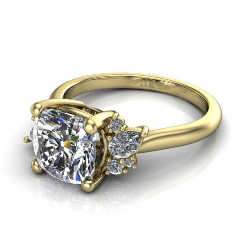 Evie cushion three stone engagement ring in 14K Yellow Gold, three-quarter perspective showing the cathedral rise and accent clusters fanning out on both sides of the center
