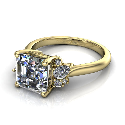 Evie emerald vintage engagement ring in 14K Yellow Gold, three-quarter perspective showing the cathedral rise and accent clusters fanning out on both sides of the center