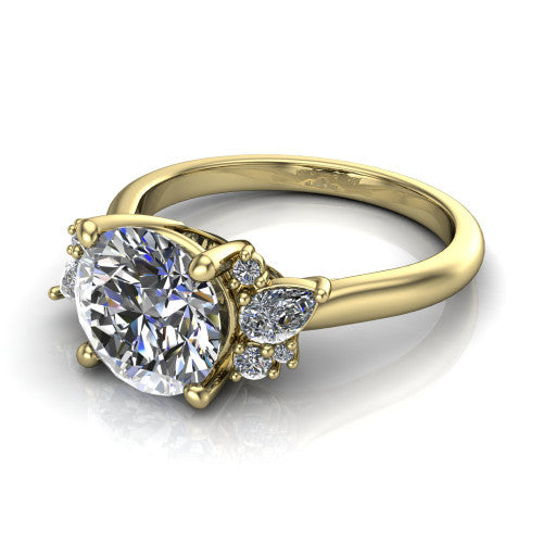 Evie round three stone engagement ring in 14K Yellow Gold, three-quarter perspective showing the cathedral rise and accent clusters fanning out on both sides of the center