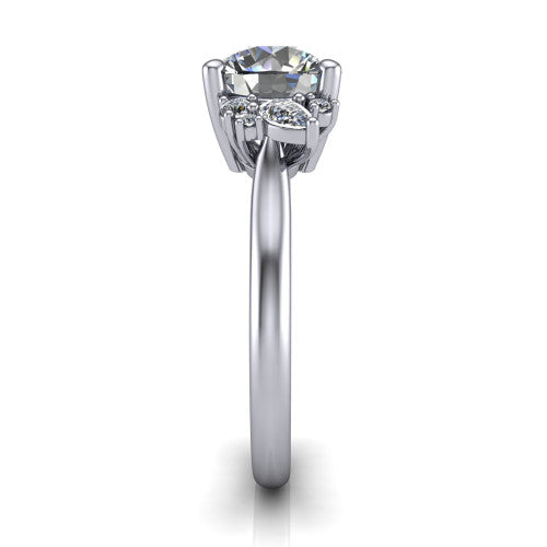 Genevieve round three stone engagement ring in Platinum, side profile showing the cluster head, tapered cathedral shoulders, and polished band