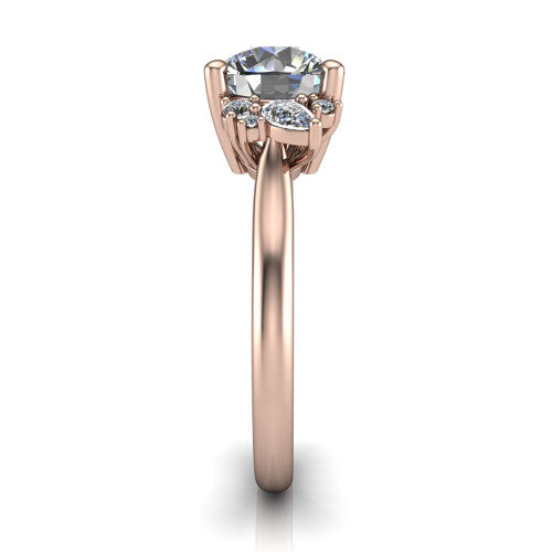 Genevieve round three stone engagement ring in 18K Rose Gold, side profile showing the cluster head, tapered cathedral shoulders, and polished band