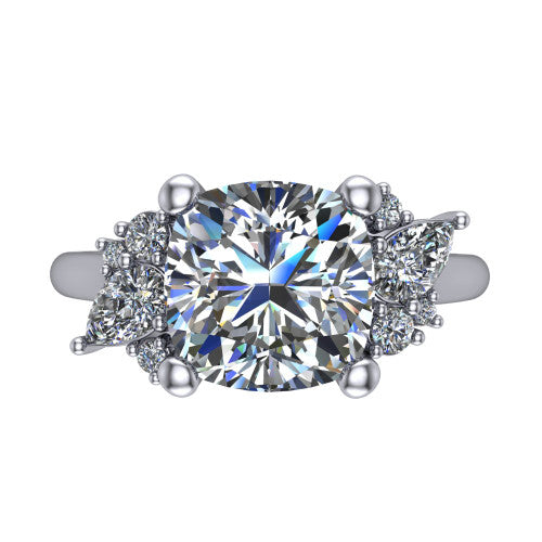 Genevieve cushion three stone engagement ring in 18K White Gold, top-down view showing the brilliant cushion-cut center diamond with diamond clusters on each side