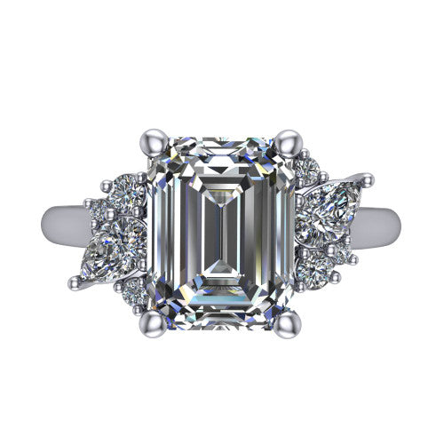 Genevieve emerald three stone engagement ring in Platinum, top-down view showing the step-cut emerald center diamond with diamond clusters on each side