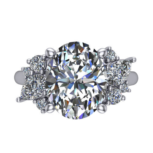 Genevieve oval three stone engagement ring in 18K White Gold, top-down view showing the brilliant oval center diamond with diamond clusters on each side
