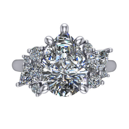 Genevieve pear three stone engagement ring in 18K White Gold, top-down view showing the brilliant pear-cut center diamond with diamond clusters on each side