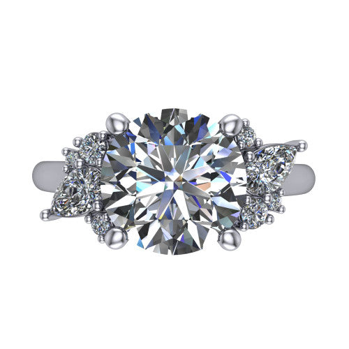 Genevieve round three stone engagement ring in 18K White Gold, top-down view showing the brilliant round center diamond with diamond clusters on each side