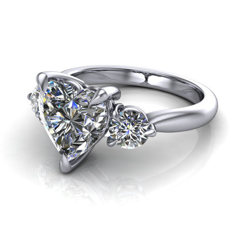 Juniper heart three stone engagement ring in 14K White Gold, three-quarter perspective showing the brilliant heart-shaped center diamond flanked by two round side diamonds on a rounded plain band