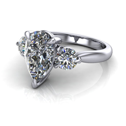 Juniper pear three stone engagement ring in 18K White Gold, three-quarter perspective showing the brilliant pear-cut center diamond flanked by two round side diamonds on a rounded plain band