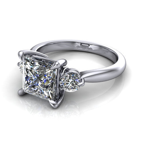 Juniper princess three stone engagement ring in 18K White Gold, three-quarter perspective showing the brilliant princess-cut center diamond flanked by two round side diamonds on a rounded plain band