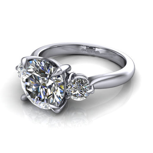 Juniper round three stone engagement ring in 14K White Gold, three-quarter perspective showing the brilliant round center diamond flanked by two round side diamonds on a rounded plain band