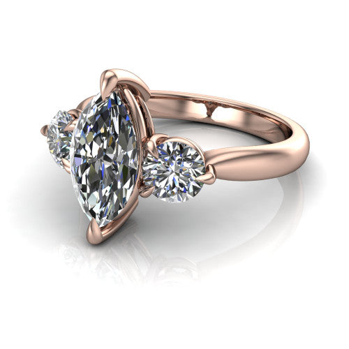 Juniper marquise three stone engagement ring in 14K Rose Gold, three-quarter perspective showing the brilliant marquise center diamond flanked by two round side diamonds on a rounded plain band