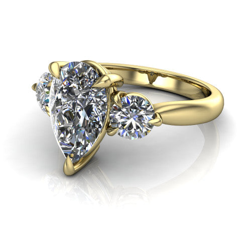 Juniper pear three stone engagement ring in 14K Yellow Gold, three-quarter perspective showing the brilliant pear-cut center diamond flanked by two round side diamonds on a rounded plain band