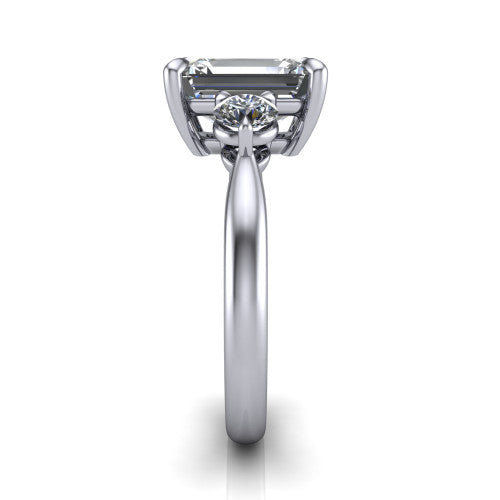 Juniper emerald three stone engagement ring in Platinum, side profile showing the three-stone head and slim rounded polished band
