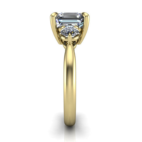 Juniper square emerald three stone engagement ring in 14K Yellow Gold, side profile showing the three-stone head and slim rounded polished band