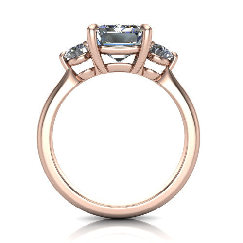 Juniper emerald three stone engagement ring in 18K Rose Gold, through-finger front profile showing the three-stone head and clean open under-gallery