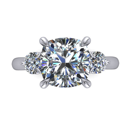 Juniper cushion three stone engagement ring in Platinum, top-down view showing the brilliant cushion-cut center diamond with two matched round side diamonds