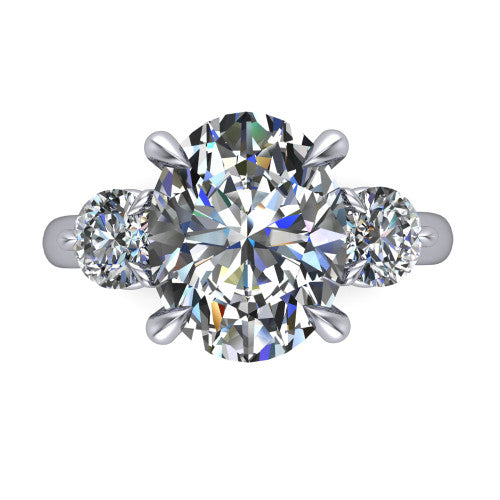 Juniper oval three stone engagement ring in 18K White Gold, top-down view showing the brilliant oval center diamond with two matched round side diamonds