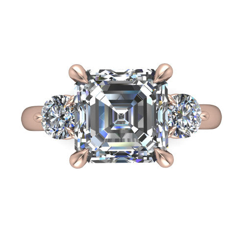 Juniper square emerald three stone engagement ring in 18K Rose Gold, top-down view showing the step-cut square emerald center diamond with two matched round side diamonds