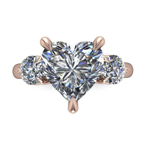 Juniper heart three stone engagement ring in 18K Rose Gold, top-down view showing the brilliant heart-shaped center diamond with two matched round side diamonds