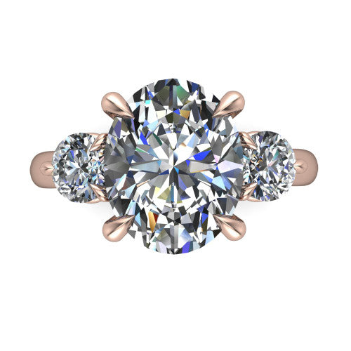 Juniper oval three stone engagement ring in 18K Rose Gold, top-down view showing the brilliant oval center diamond with two matched round side diamonds