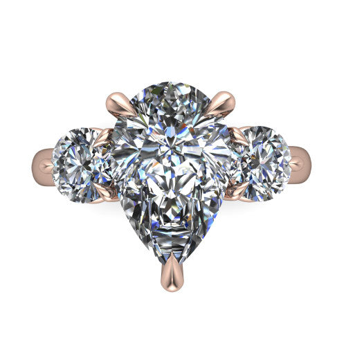Juniper pear three stone engagement ring in 18K Rose Gold, top-down view showing the brilliant pear-cut center diamond with two matched round side diamonds