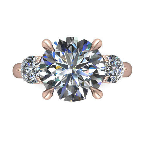 Juniper round three stone engagement ring in 14K Rose Gold, top-down view showing the brilliant round center diamond with two matched round side diamonds