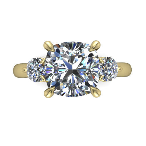 Juniper cushion three stone engagement ring in 18K Yellow Gold, top-down view showing the brilliant cushion-cut center diamond with two matched round side diamonds