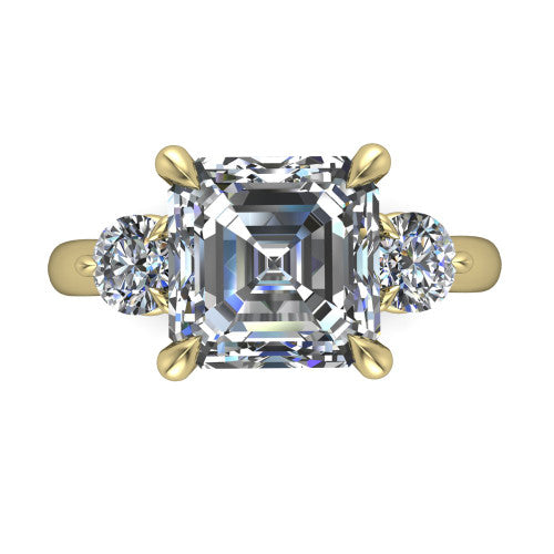 Juniper square emerald three stone engagement ring in 14K Yellow Gold, top-down view showing the step-cut square emerald center diamond with two matched round side diamonds