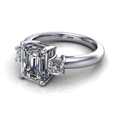 Penelope emerald three stone engagement ring in 14K White Gold, three-quarter perspective showing the step-cut emerald center diamond, two matched step-cut emerald side diamonds