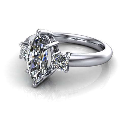 Penelope marquise three stone engagement ring in Platinum, three-quarter perspective showing the brilliant marquise center diamond, two matched marquise side diamonds