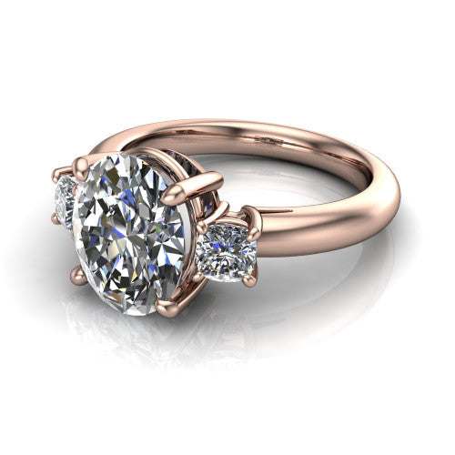 Penelope oval three stone engagement ring in 18K Rose Gold, three-quarter perspective showing the brilliant oval center diamond, two matched oval side diamonds