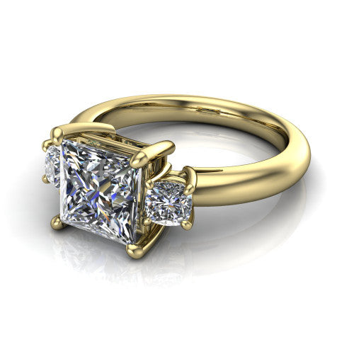 Penelope princess three stone engagement ring in 18K Yellow Gold, three-quarter perspective showing the brilliant princess-cut center diamond, two matched princess-cut side diamonds