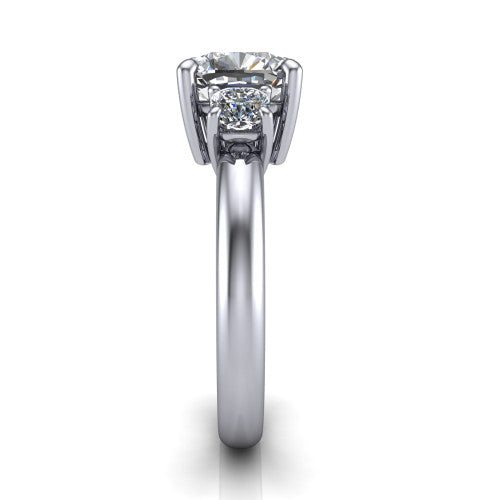 Penelope cushion three stone engagement ring in Platinum, side profile showing the tall straight-sided basket and slim polished band