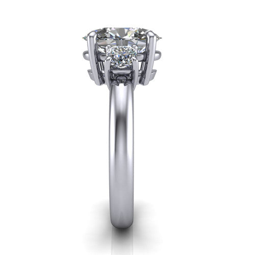 Penelope oval three stone engagement ring in Platinum, side profile showing the tall straight-sided basket and slim polished band