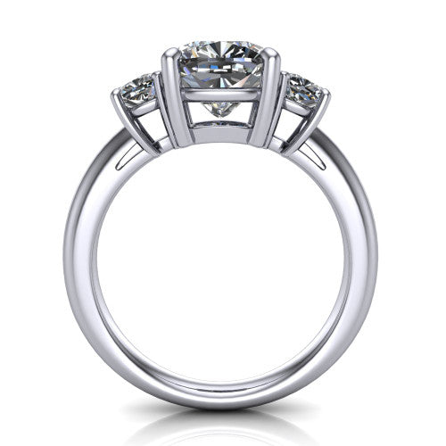 Penelope cushion three stone engagement ring in Platinum, through-finger front profile showing the three-stone head, tall basket, and open under-gallery