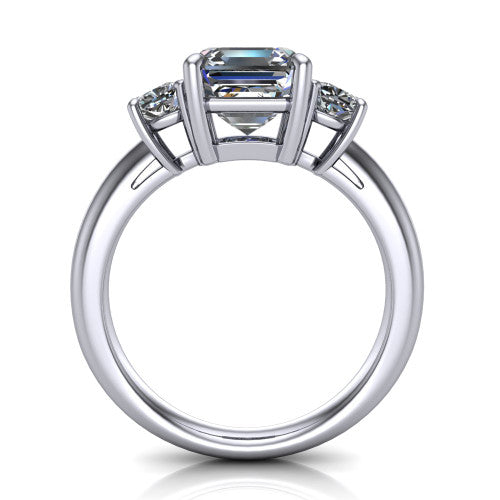 Penelope square emerald three stone engagement ring in Platinum, through-finger front profile showing the three-stone head, tall basket, and open under-gallery