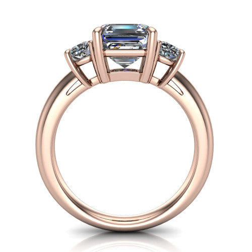 Penelope square emerald three stone engagement ring in 14K Rose Gold, through-finger front profile showing the three-stone head, tall basket, and open under-gallery