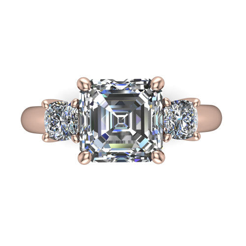 Penelope square emerald three stone engagement ring in 18K Rose Gold, top-down view showing the step-cut square emerald center diamond, two matched square emerald side diamonds aligned across the band