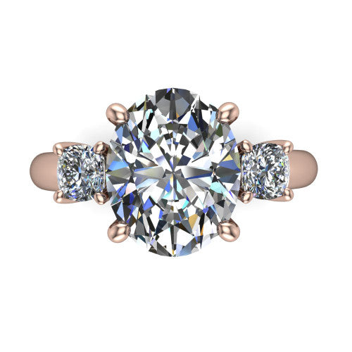 Penelope oval three stone engagement ring in 18K Rose Gold, top-down view showing the brilliant oval center diamond, two matched oval side diamonds aligned across the band
